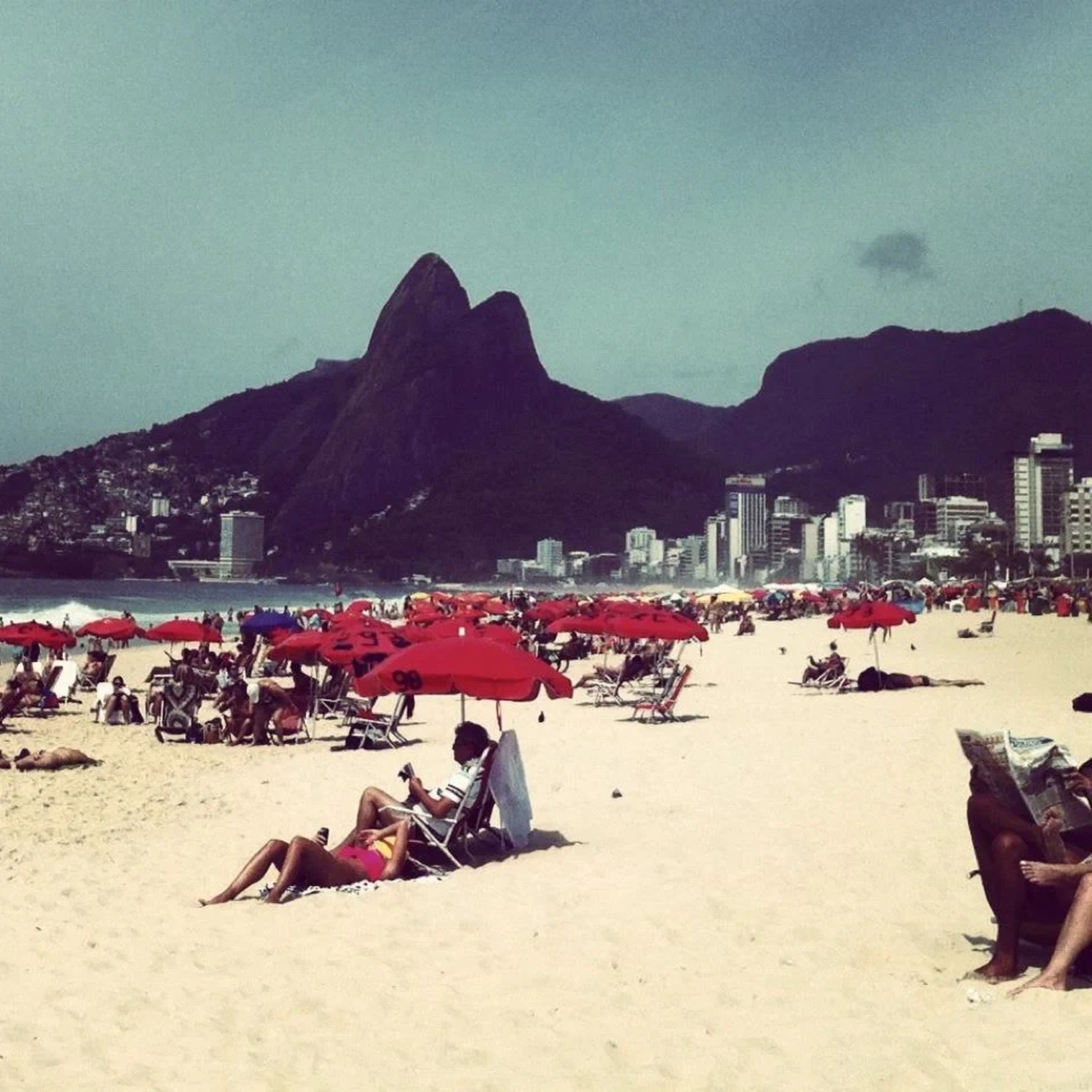 Sunlit Ipanema beach beneath the Dois Irmãos mountains, from the Avuá archive